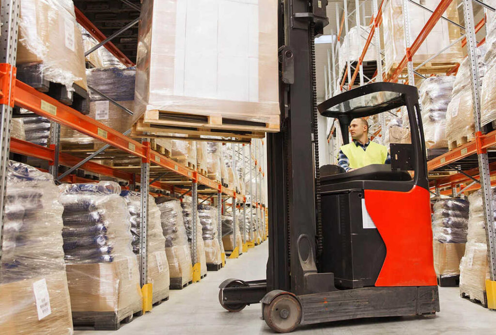 Man using forklift for heavy box