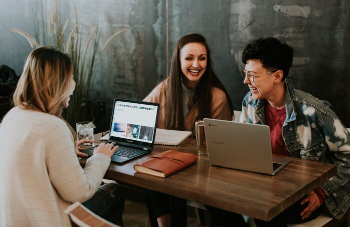 People laughing sat at table