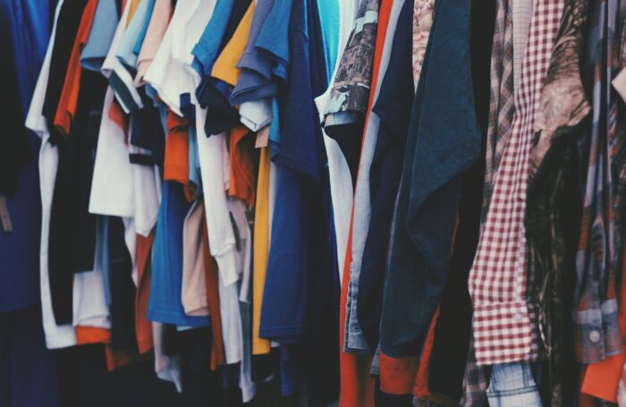 Coloured tshirts and shirts on a rail
