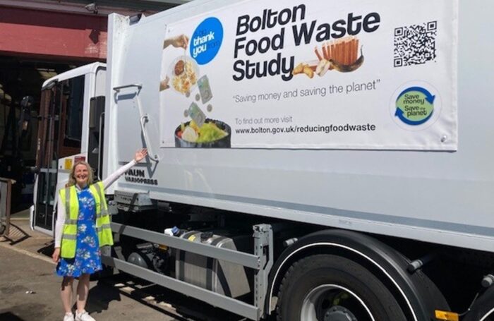 Bryony O'Connor stood next to Bolton Waste Vehicle
