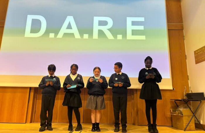 Children at Dukesgate Academy on stage at Oxford University