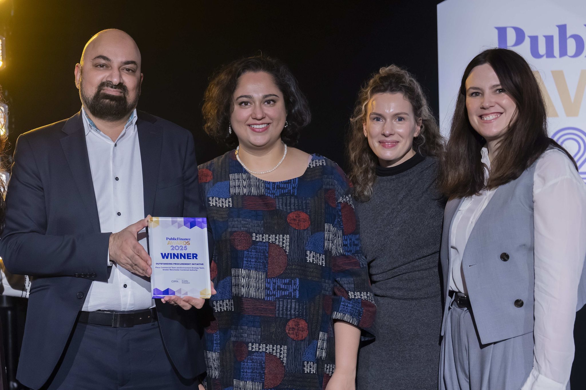 Public Finance Awards 2025 winners holding an award plaque