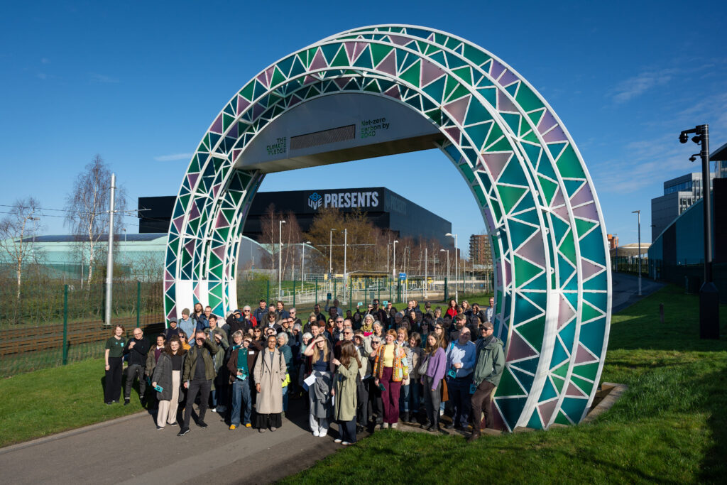 Cyan lines walkers standing under carbon counter archway
