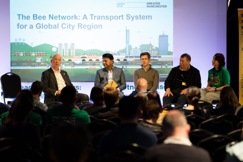 Panel members sat on stage